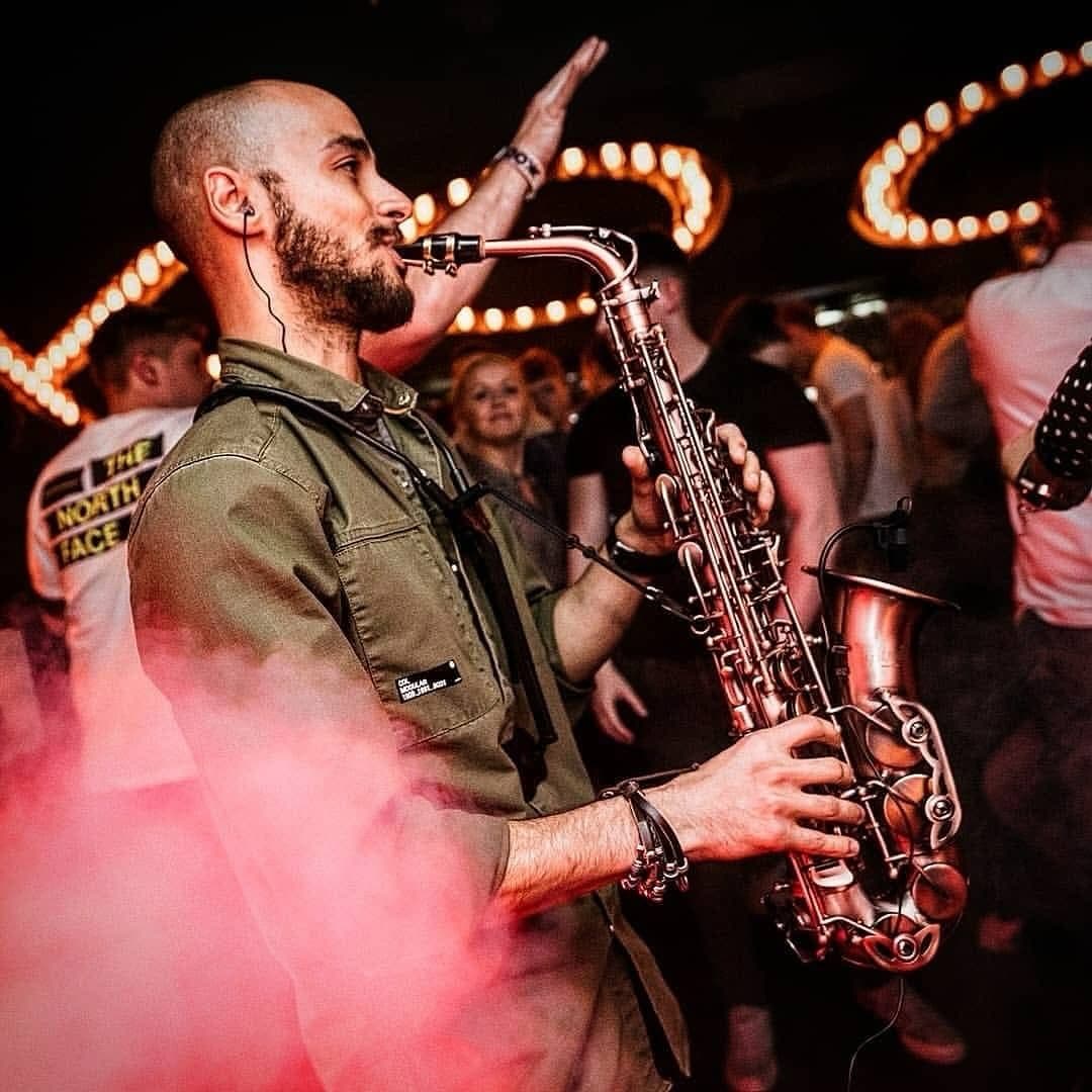 Victor Jazz playing live saxophone for a crowded wedding reception Cyprus